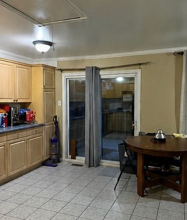 The same kitchen after an Aurofresh clean, with clear floors, tidy surfaces and a spotless dining area